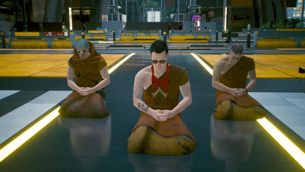 Three monks meditating beneath the FF:06:B5 monument